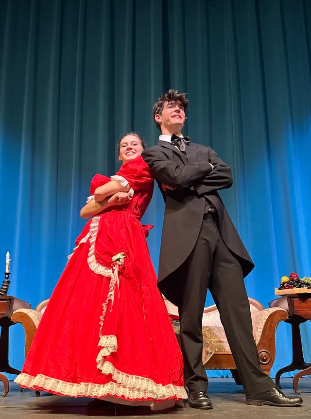 Performer in a red dress on stage